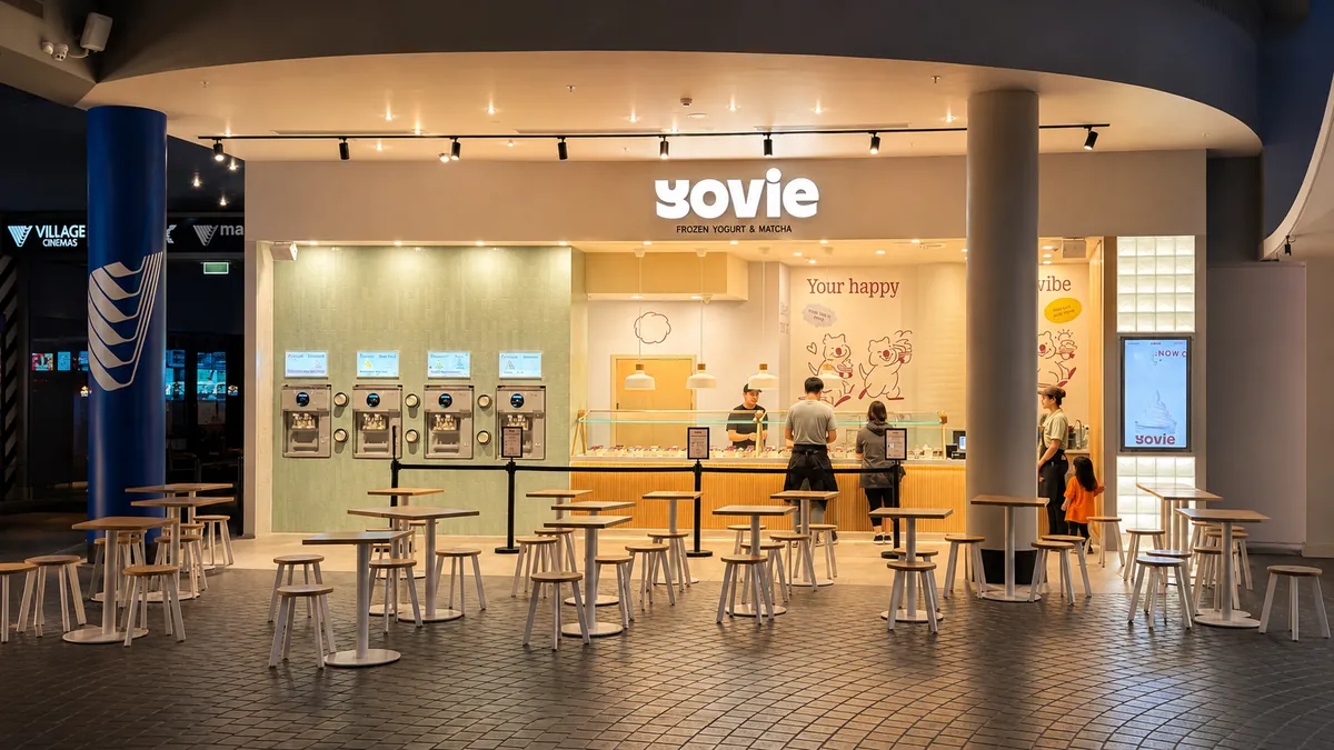 YOVIE store frontage with frozen yogurt machines and seating